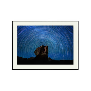 P-10-101-117-107-0028-1.jpg;full color, space, night sky, long-exposure photo, stars, rock formation, blue, black, white, reddish brown