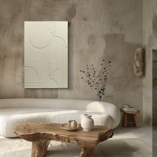 Modern interior with a textured wall, white sofa, wooden coffee table, and abstract art.