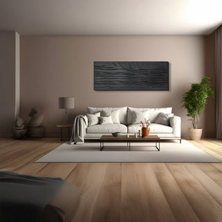 Modern living room with a gray sofa, coffee table, and decorative items.